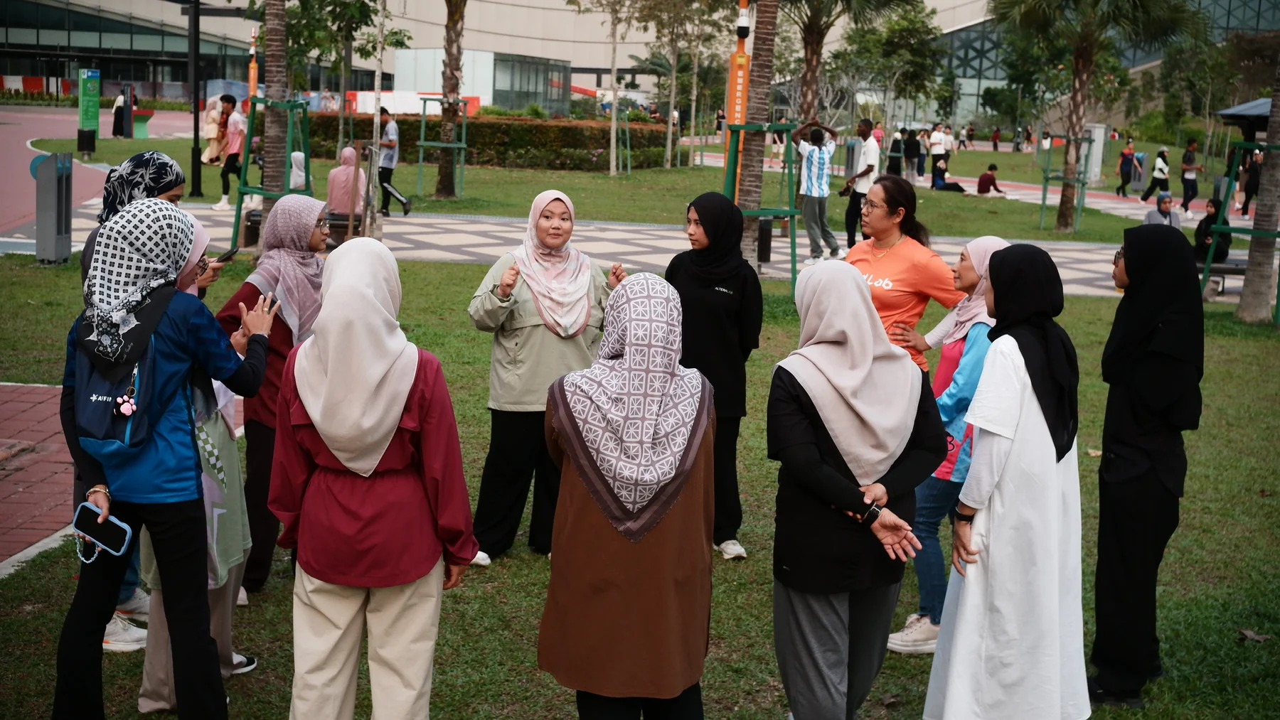 Participants gathering in a circle outdoors