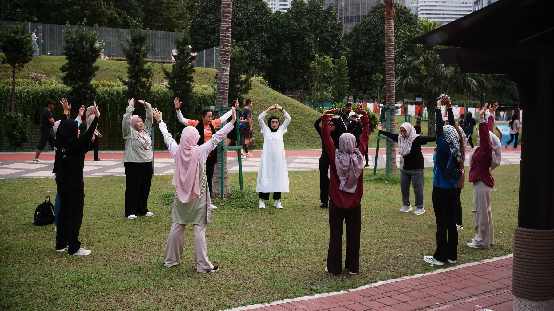 Participants following a shared movement activity outdoors